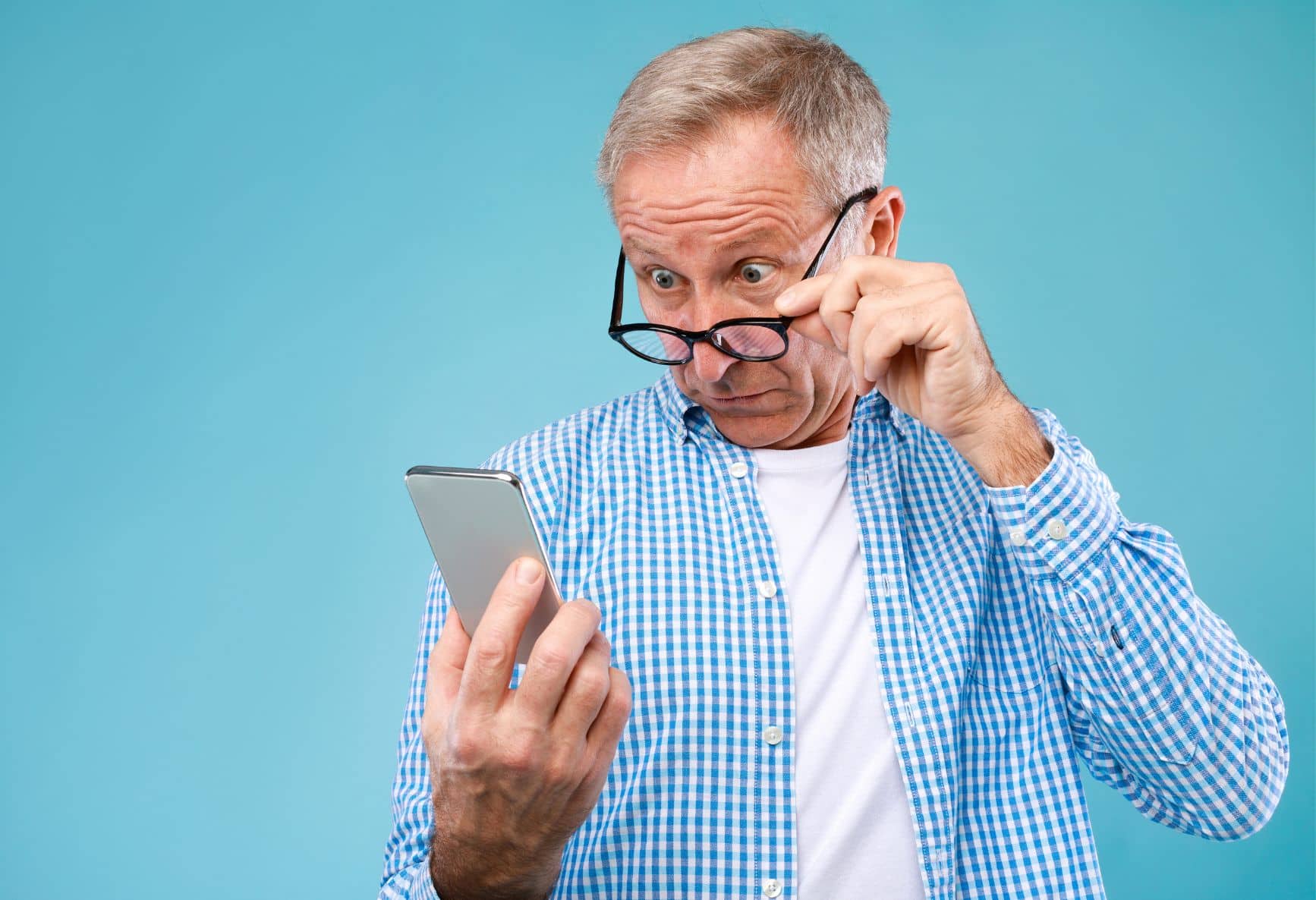 Older man straining to see website content
