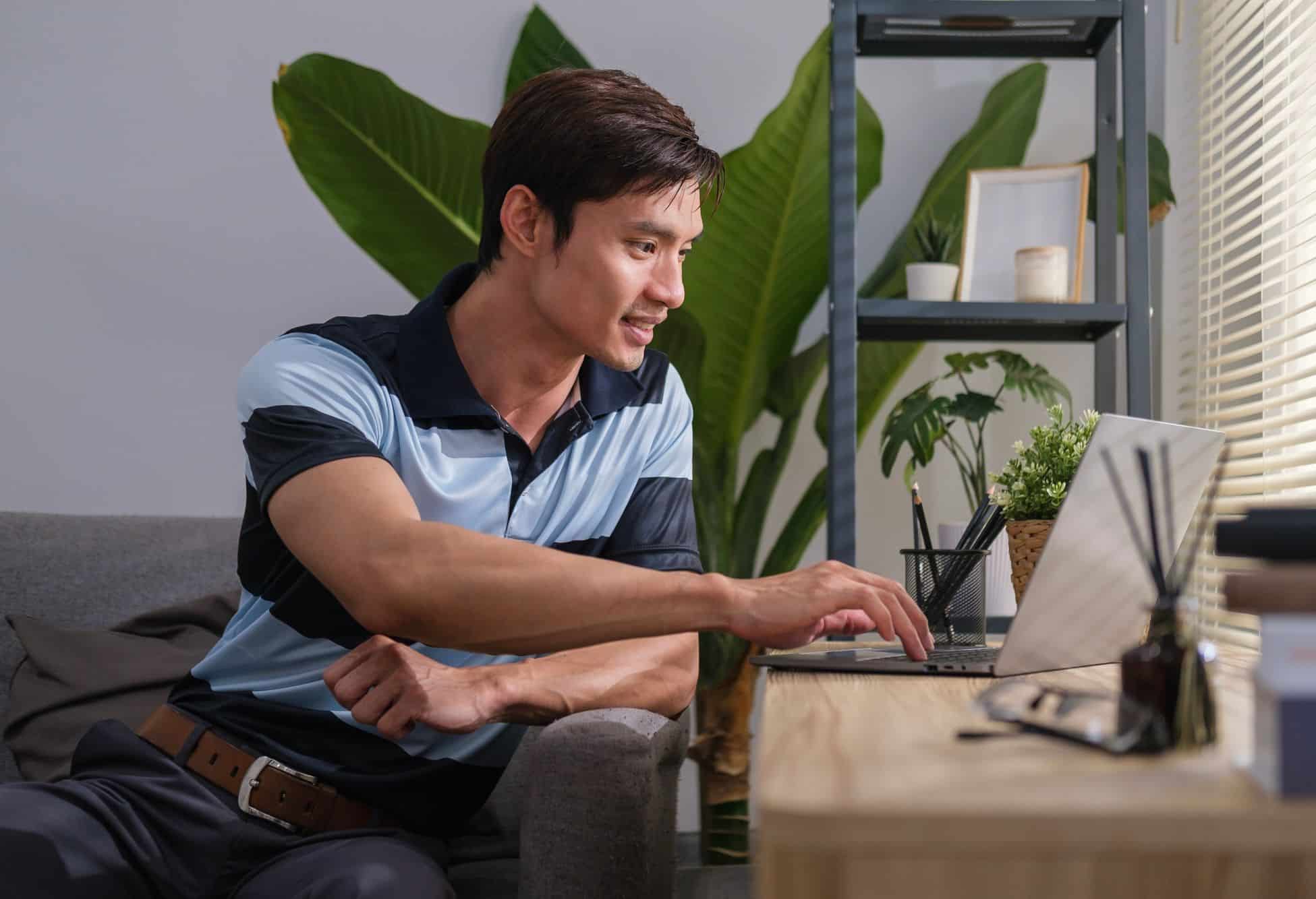 Man smiling while browsing website