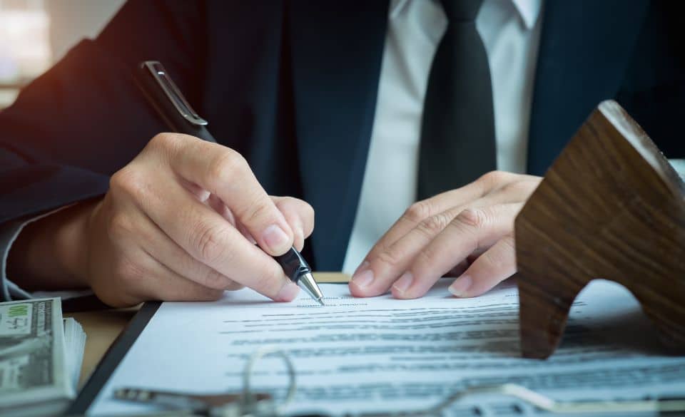 Lawyer signing contract
