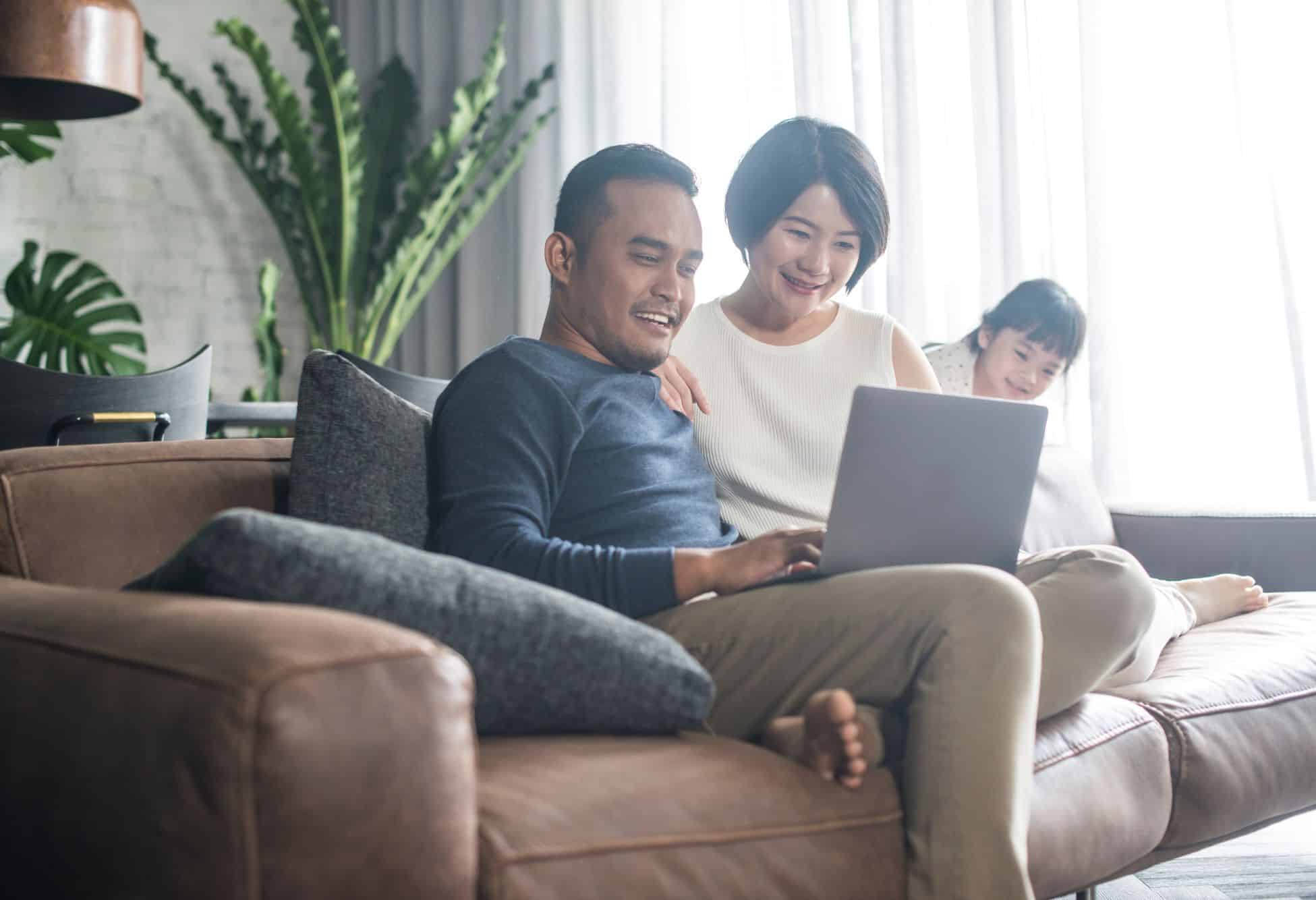Happy family looking at computer